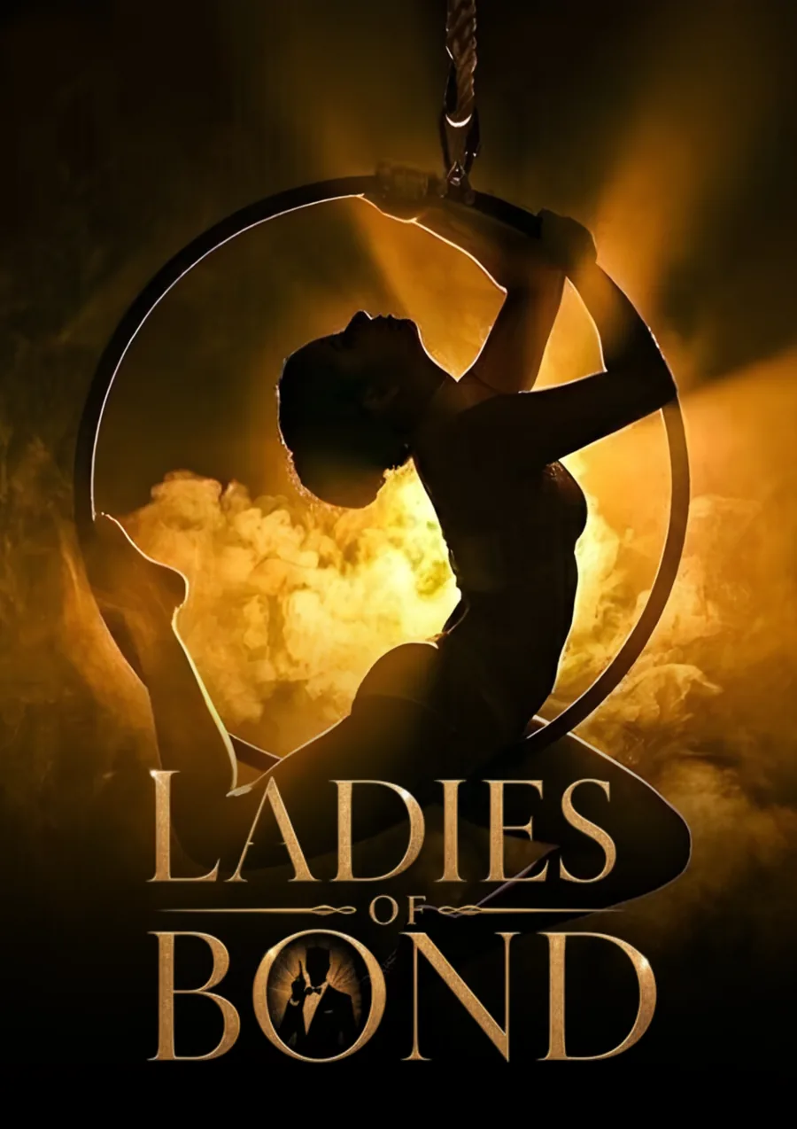 Ladies of Bond – aerial artist in a hoop against golden smoke